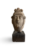 Romanesque-style stone head