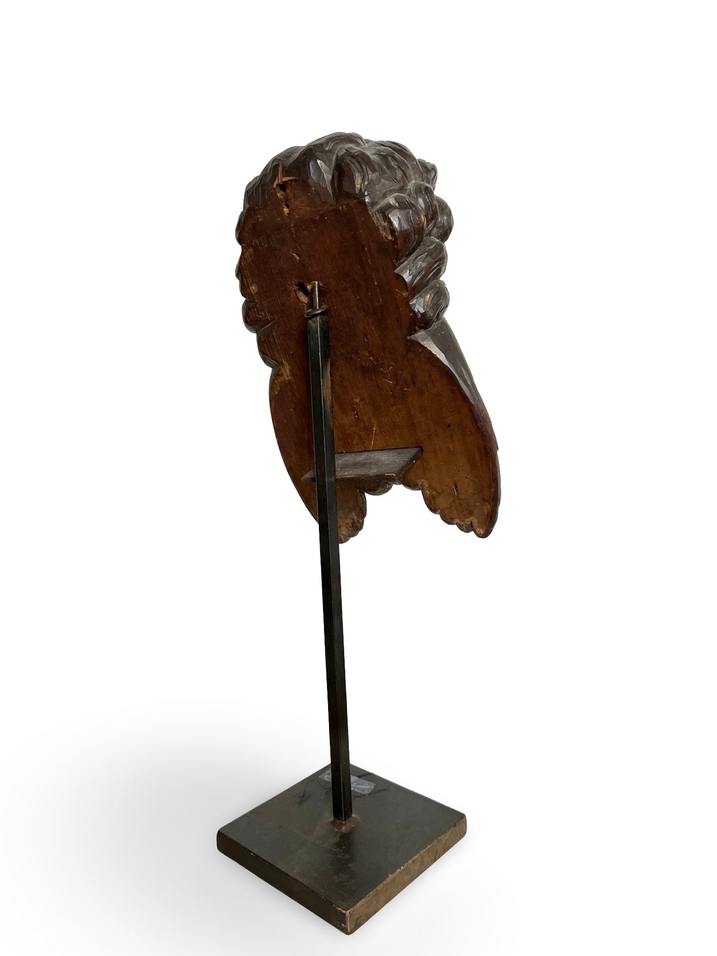 Finely carved wooden cherub head with layered wings