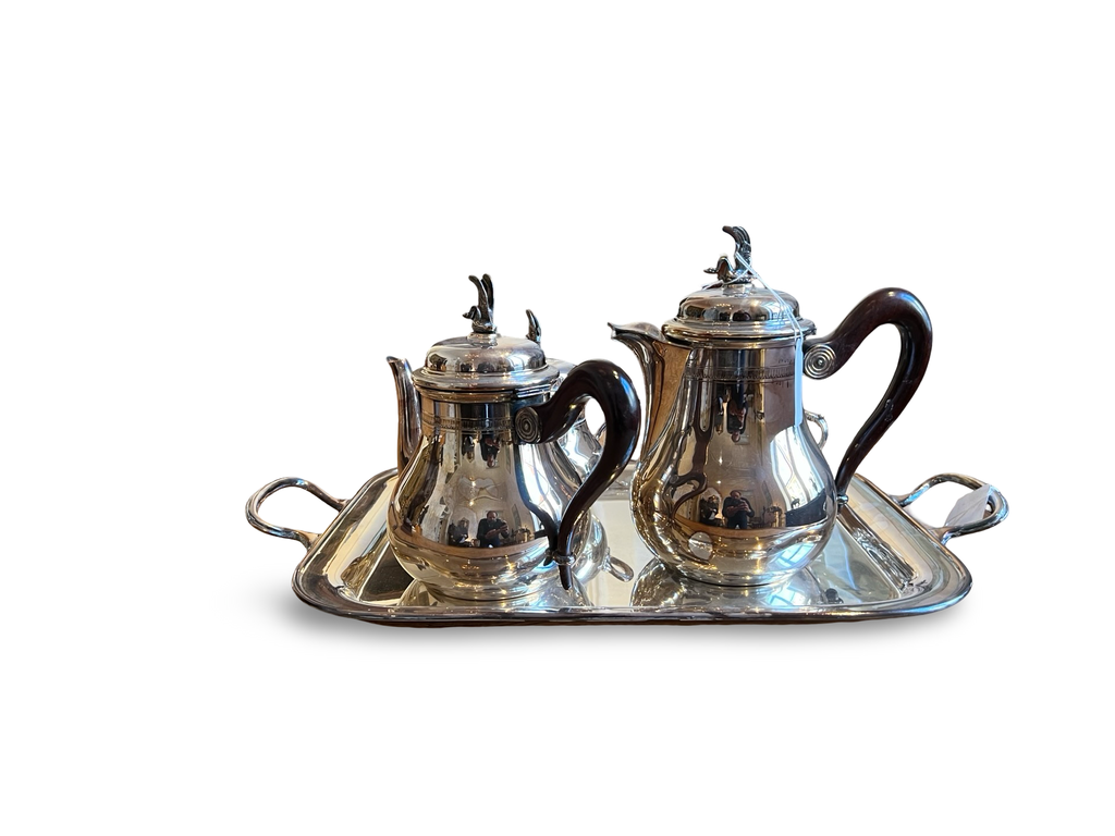 A continental silver coffee service with beautiful curves