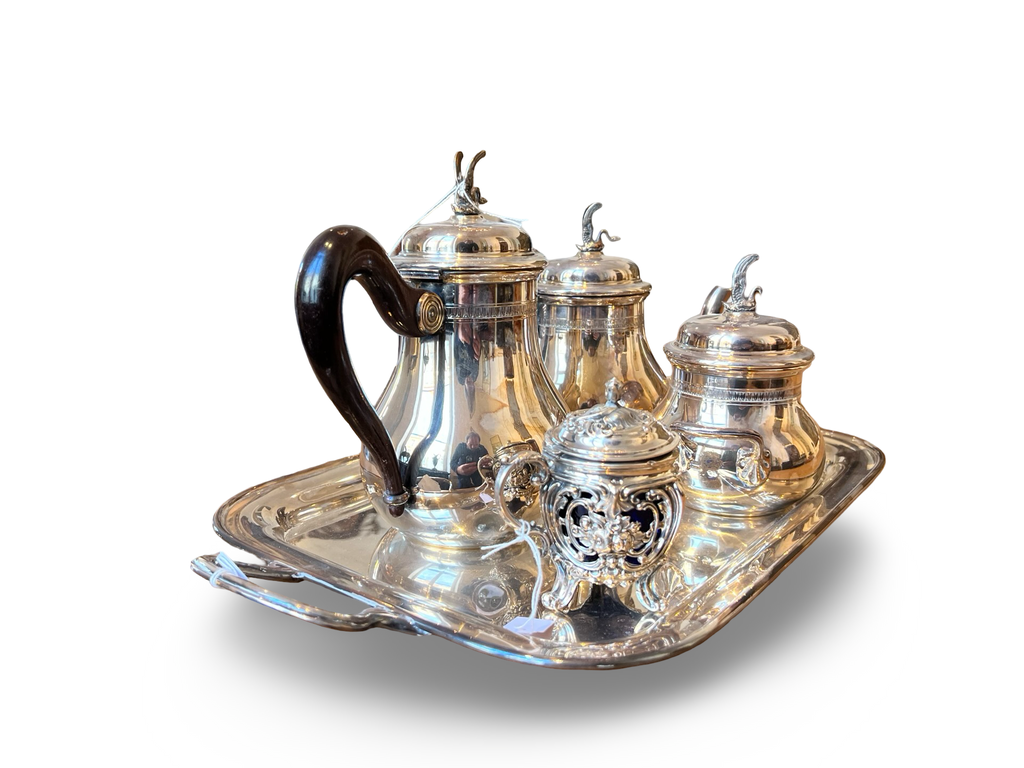 A continental silver coffee service with beautiful curves